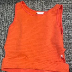 Orange cropped tank top with small open sides